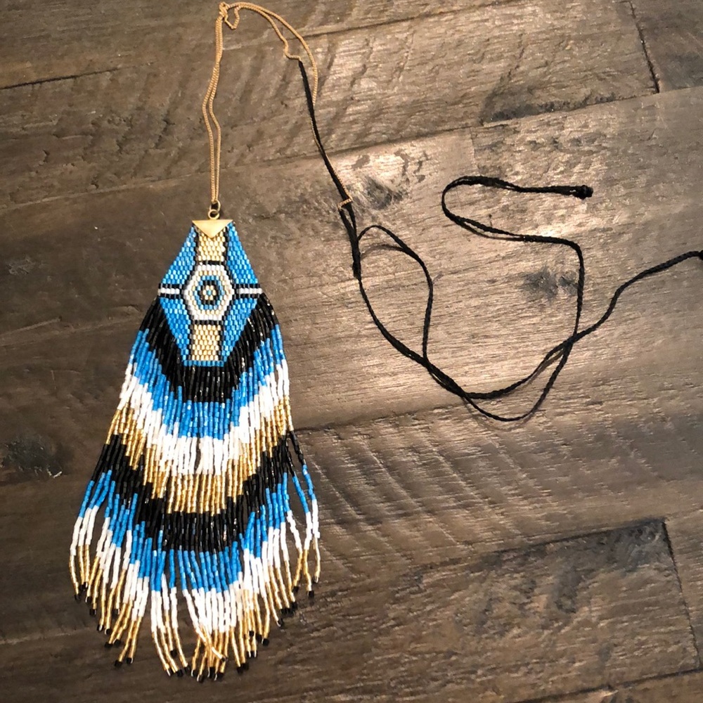 Necklace with Native American inspired design. Finest bead work with silk string